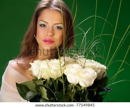 pretty young woman and a bouquet of roses