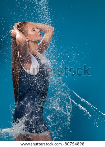 woman in a bathing suit and a jet of water