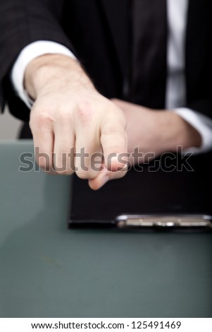 Businessman pointing finger at You