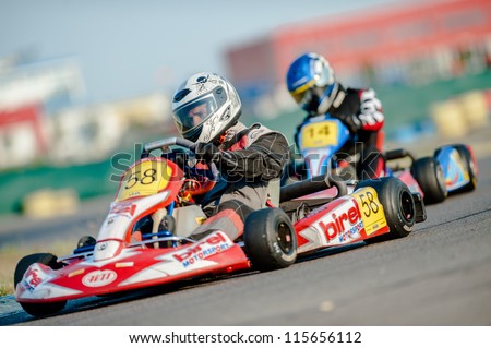 BUCHAREST ROMANIA AUGUST 4 Unknown pilots competing in National Karting Championship 2012 at Amkart Bucharest on August 4 in Bucharest Romania BUCHAREST ROMANIA AUGUST 4 Unknown pilots competing in National Karting Championship 2012 at Amkart Bucharest on August 4 in Bucharest Romania