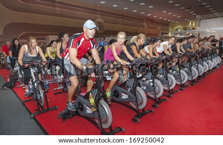 BUCHAREST, ROMANIA - AUGUST 20, 2013: Spinning marathon challenge. Charity sport event organized by World Master Class, on August 20, 2013, in Romexpo at Bucharest, Romania.