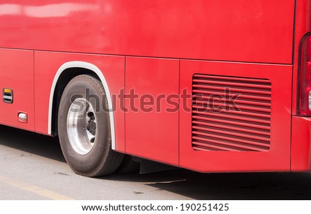 Side of the red bus for journey