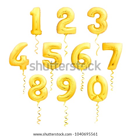 Golden numbers made of inflatable balloons with golden ribbons isolated on white background