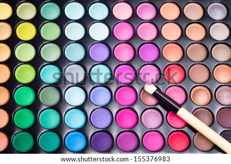Colorful Eye Shadows Palette With Professional Makeup Brush. Makeup Background