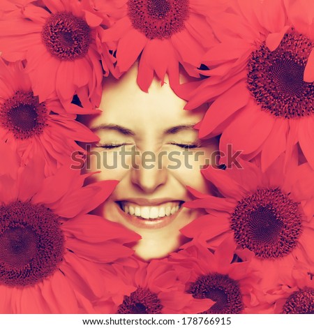 Woman face and pink flowers. Filtered image