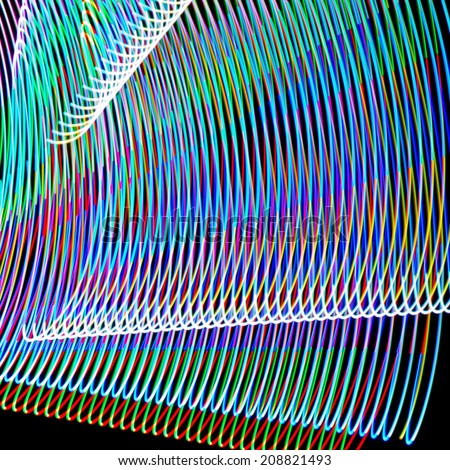 Abstract curved lines made of light painting or freezelight.