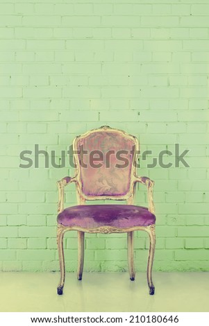 Vintage chair in empty room. Toned image