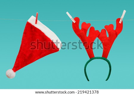 Santa hat and antler of deer on a clothesline