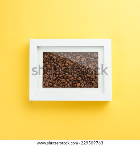 Coffee concept - coffee beans in a photo frame. Coffee like a picture on a wall