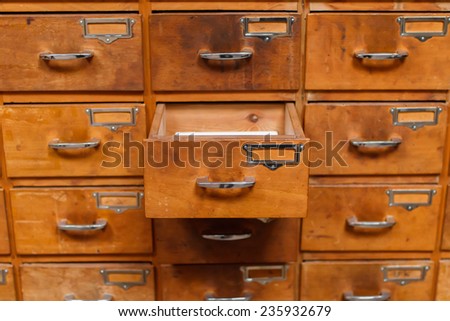 Opened drawer in vintage storage module