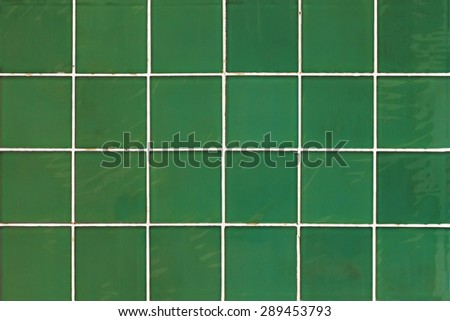 Green wall with square tiles