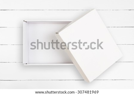 Opened empty cardboard box with cover on white background