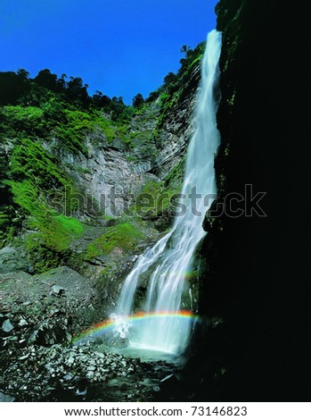 waterfall in rainbow view at Jiu Ding Mountain,in SiChuan,China