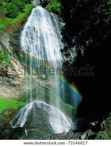 waterfall in rainbow,view at JiuDing mountain,in SiChuan,China