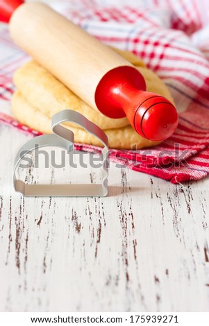 Cooking Easter Biscuits. Fresh Sweet Dough, Wooden Rolling Pin And Funny Bunny Cookie Cutter On A White Wooden Board With Place For Text.