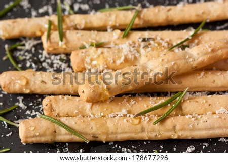 Grissini bread sticks with cheese  and rosemary close-up.