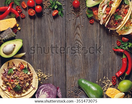 Fresh delicious mexican tacos and food ingredients.