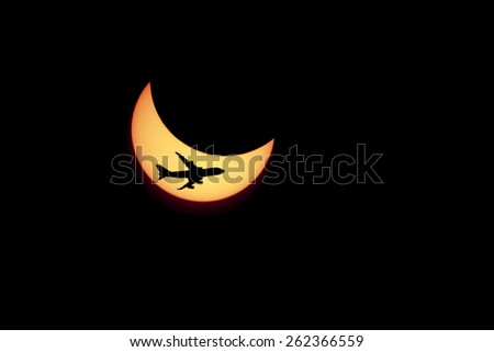 solar Eclipse and flying against the plane.
