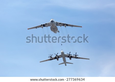 MOSCOW, RUSSIA - MAY 9, 2015:Russian Air Force IL-78M air-to-air refueling tanker demonstrates in-flight refueling of Tu-95MS strategic bomber during  for Victory Day military parade