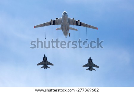 MOSCOW, RUSSIA - MAY 9, 2015:Russian Air Force IL-78 air-to-air refueling tanker demonstrates in-flight refueling of Mikoyan MiG-31 strategic bomber during for Victory Day military parade