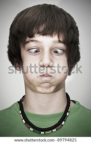 stock photo crosseyed young teenager boy