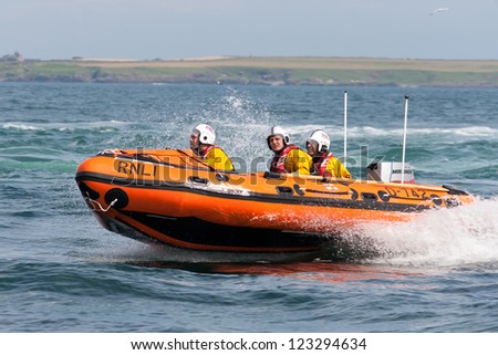 PORT ST. MARY, ISLE OF MAN, UK - AUGUST 22: Port St. Mary inshore lifeboat taking part in RNLI lifeboat festival on August 22, 2012 at Port St. Mary in the Isle of Man, UK.