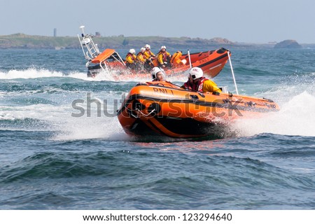 PORT ST. MARY, ISLE OF MAN, UK - AUGUST 22: Port St. Mary inshore lifeboat and Port Erin lifeboat taking part in RNLI lifeboat festival on August 22, 2012 at Port St. Mary in the Isle of Man, UK.