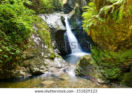 Glen Maye Waterfall tourist site near Peel in the Isle of Man, landscape orientation