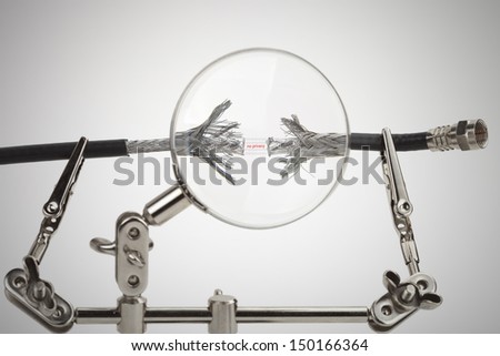 Internet security concept, the words no privacy between two disconnected coaxial cables with a magnifying glass