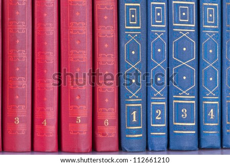books in multicolored covers, view from back