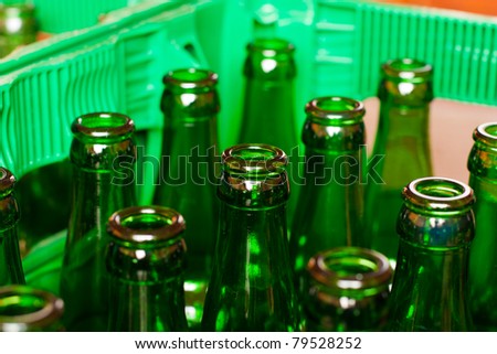 A crate of empty beer bottles.