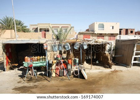 Improvised gas station along the road to the Sahara desert in Tunisia. Tunisians buy gasoline in Libya at a cheaper price and reselling it along major national roads.