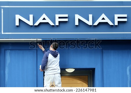 ZAGREB, CROATIA - FEBRUARY 24 : A worker wall painting the exterior of a NAF NAF store on February 24th, 2014  in Zagreb, Croatia. NAF NAF is a French brand of women\'s clothing and accessories.
