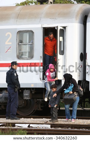 DUGO SELO,CROATIA-SEPTEMBER 17:Syrian refugees getting off the train after arriving from Serbia and waiting for the buses to continue to continue the journey on September 17, 2015 in Dugo Selo,Croatia