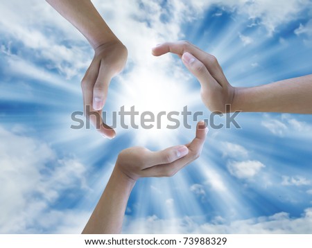 stock photo : three hand holding the sun
