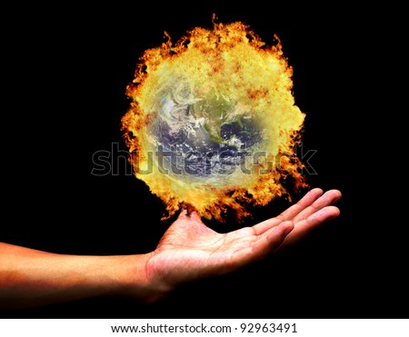 Hand holding burning earth(Earth view image from http://visibleearth.nasa.gov/ )