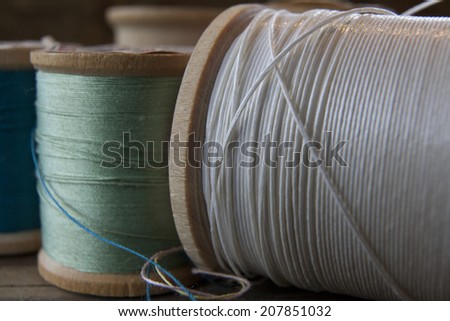 Vintage spool of multicolored cotton thread macro