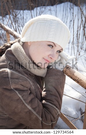 young girl in white beret walks in the Spring City
