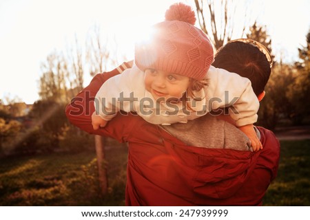 Vintage color photo happy joyful father having fun throws up in the air daughter, family, travel, vacation, father's day - concept. Sunlight on the sunset, spring day