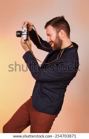 man with a camera, vintage, man with a camera, vintage, man photographs. model in studio