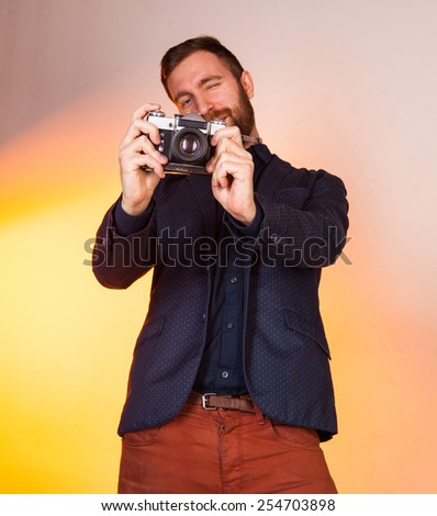 man with a camera, vintage, man with a camera, vintage, man photographs. model in studio