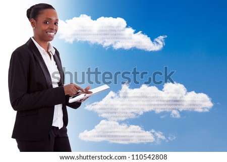 Smiling african american businesswoman using a tactile tablet, isolated on white background