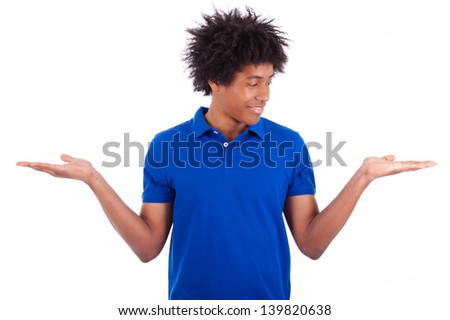 Portrait of a young african american man holding something, isolated on white background - Black people
