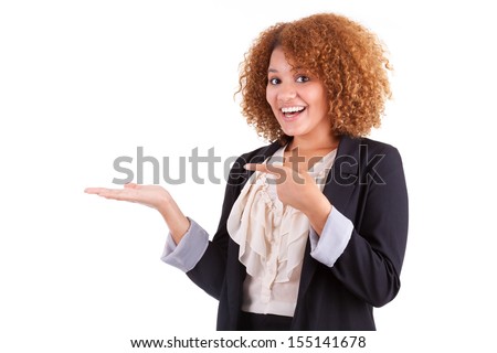 Portrait of a young african american business woman holding something in her hand palm, isolated on white background - Black people