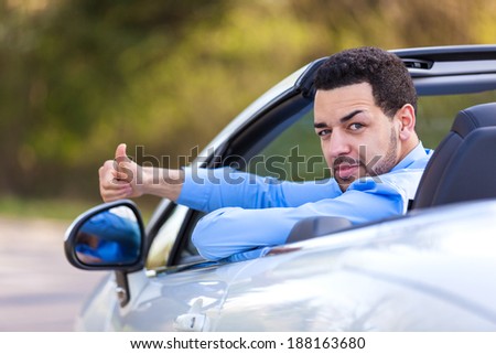 Young black latin american driver making thumbs up - Black people