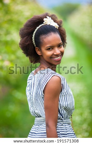 Outdoor portrait of a young beautiful african american woman - Black people