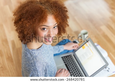 Black African American student girl using a laptop