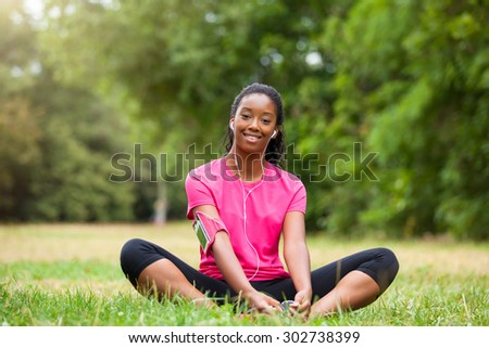 African american woman jogger stretching  - Fitness, people and healthy lifestyle