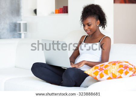 African American student girl using a laptop computer - black people