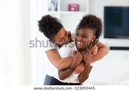 African American best friends portrait hugging - Black people